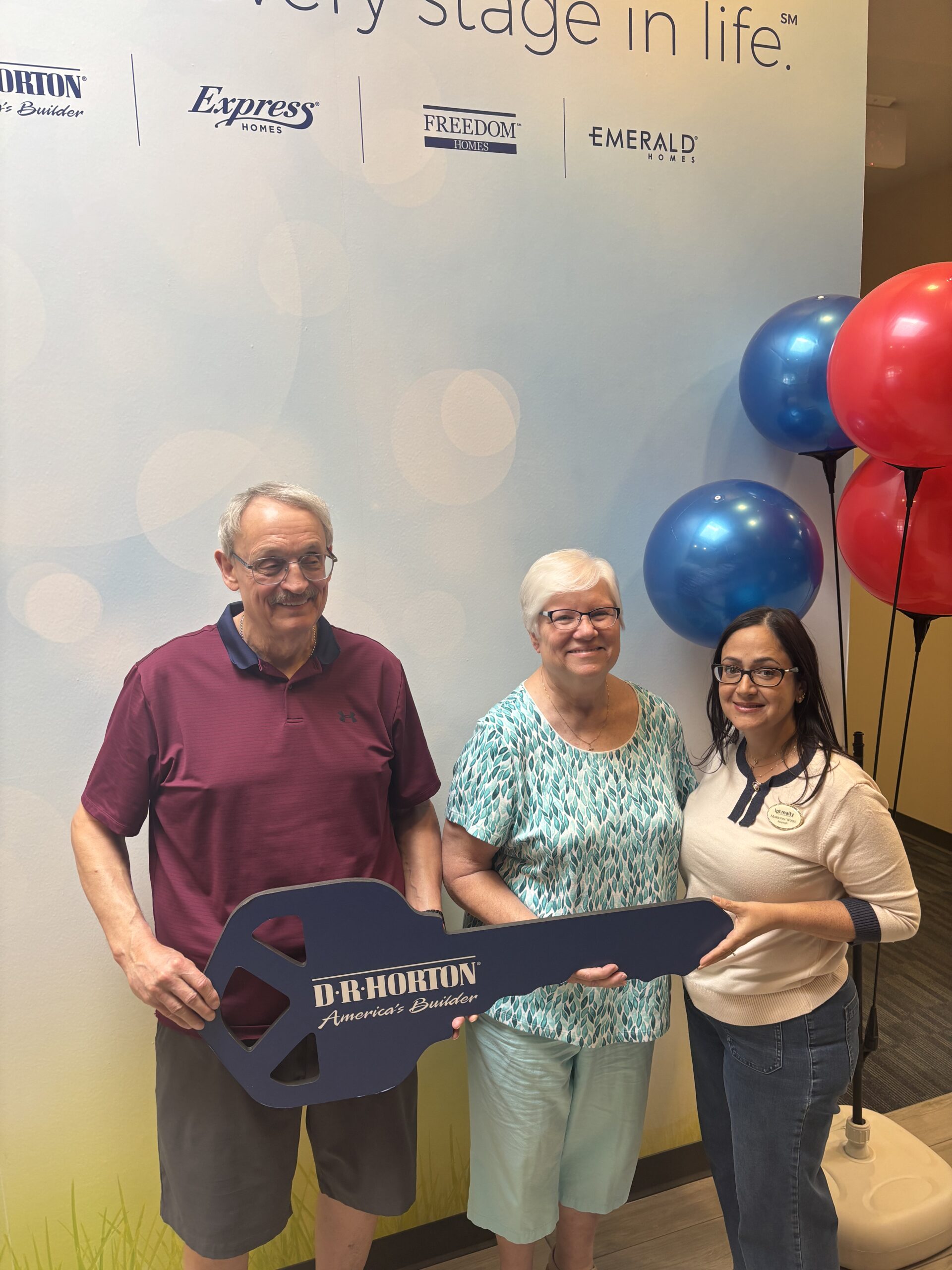 Marilynn Wolfe with new homeowners