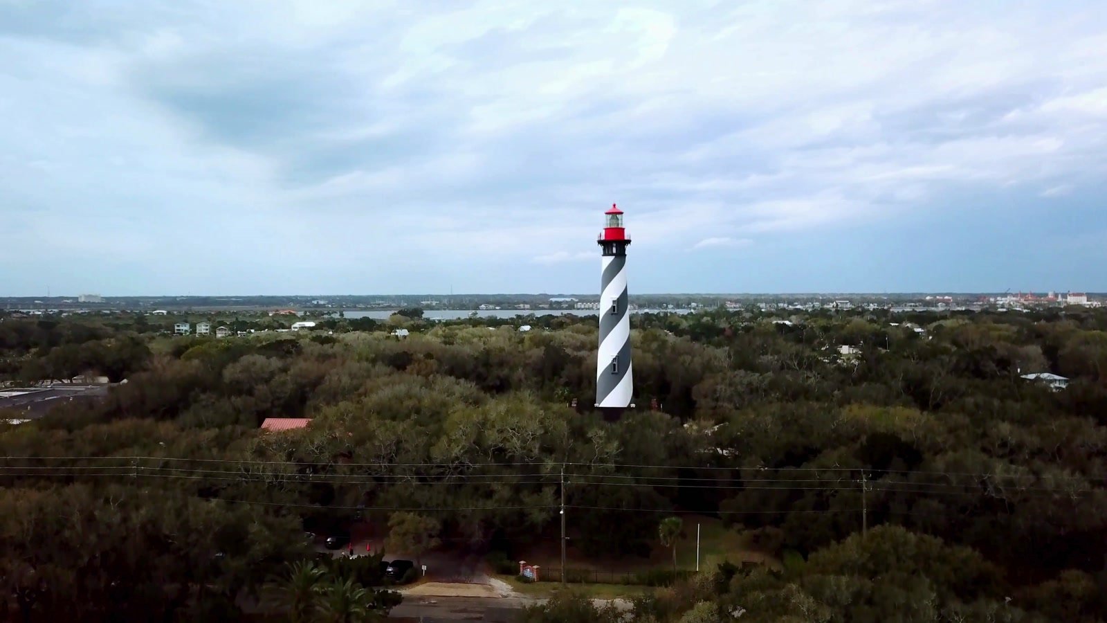 St. Augustine Lighthouse rising above the tree canopy, still from Marilynn’s video
